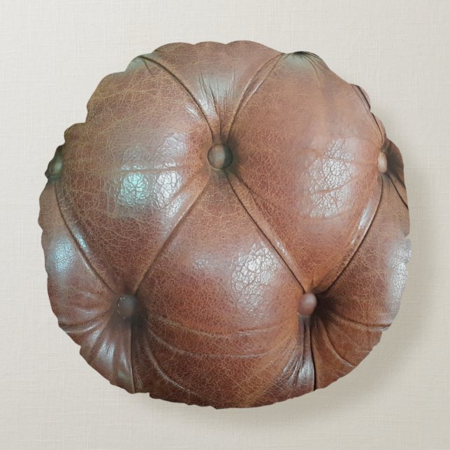 Light on brown leather sofa surface, textureabstra round pillow (Front)