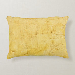 light yellow abstract textured plaster on the wall accent pillow