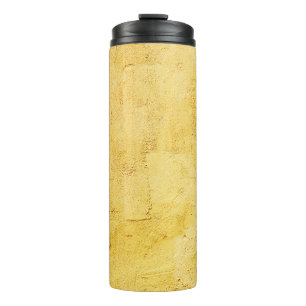 light yellow abstract textured plaster on the wall thermal tumbler