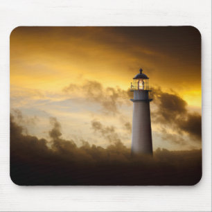 Lighthouse Glowing under Dramatic Sky Mouse Pad