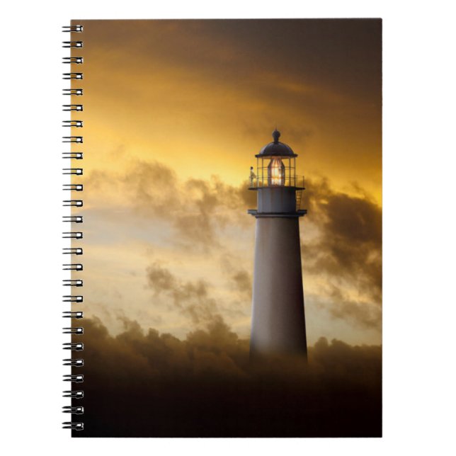 Lighthouse Glowing under Dramatic Sky Notebook (Front)