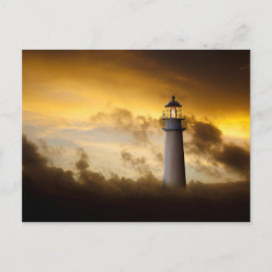 Lighthouse Glowing under Dramatic Sky Postcard