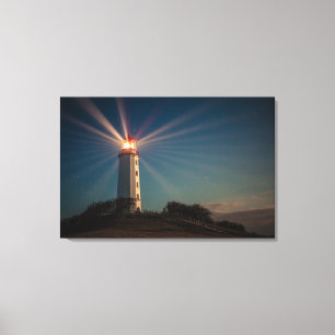 Lighthouse on a Hill Shining at Night Canvas Print