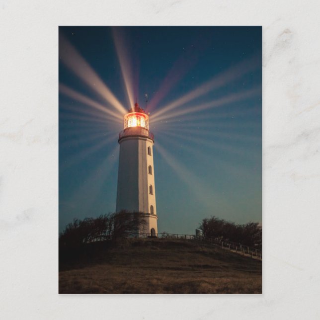 Lighthouse on a Hill Shining at Night Postcard (Front)