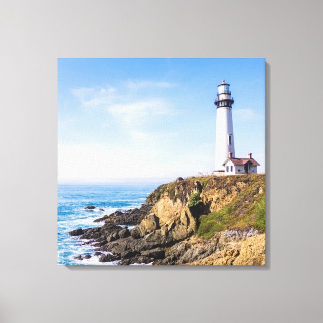 Lighthouse on hill blue sky white house ocean canvas print (Front)