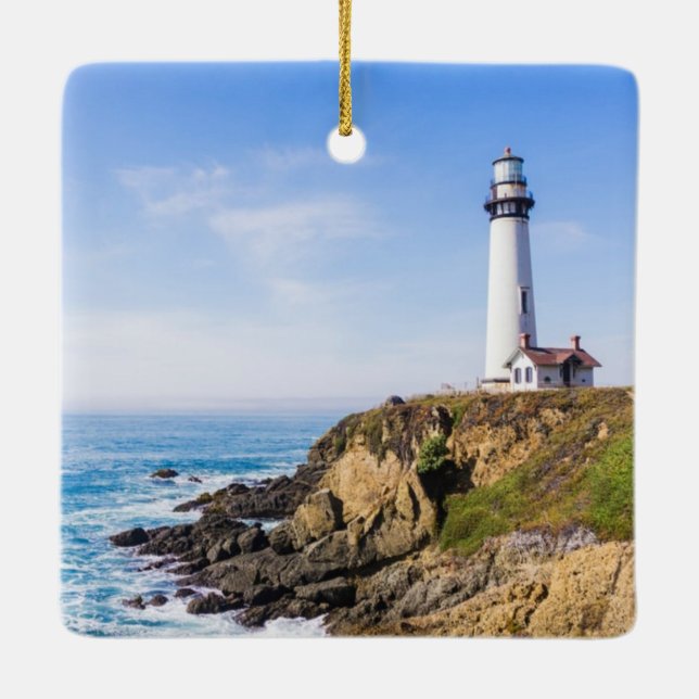 Lighthouse on hill blue sky white house ocean ceramic ornament (Back)
