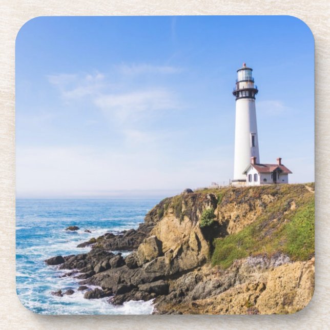 Lighthouse on hill blue sky white house ocean coaster (Front)