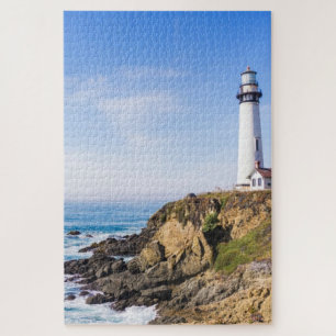 Lighthouse on hill blue sky white house ocean jigsaw puzzle