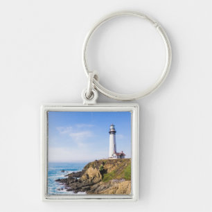 Lighthouse on hill blue sky white house ocean keychain