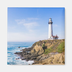 Lighthouse on hill blue sky white house ocean magnet