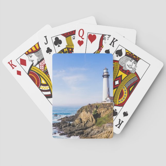 Lighthouse on hill blue sky white house ocean playing cards (Back)