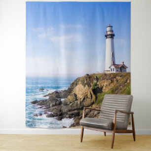 Lighthouse on hill blue sky white house ocean tapestry