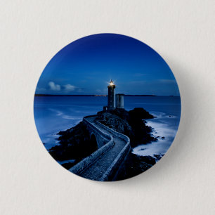 Lighthouse on wall in ocean at night 2 inch round button