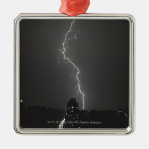 Lightning over city metal ornament
