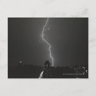 Lightning over city postcard