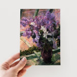 Lilacs in a Window | Mary Cassatt Postcard<br><div class="desc">Lilacs in a Window (1880) by Mary Cassatt is a delicate still-life painting that showcases a vase filled with vibrant lilacs placed near a window. The artwork captures the beauty of fresh blooms and the gentle light filtering through the glass, evoking a sense of tranquillity. Cassatt’s careful attention to detail...</div>
