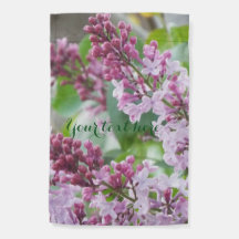 Lilacs in spring garden flag