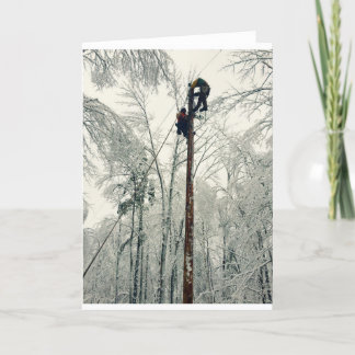 Linemen climbing pole restoring power card