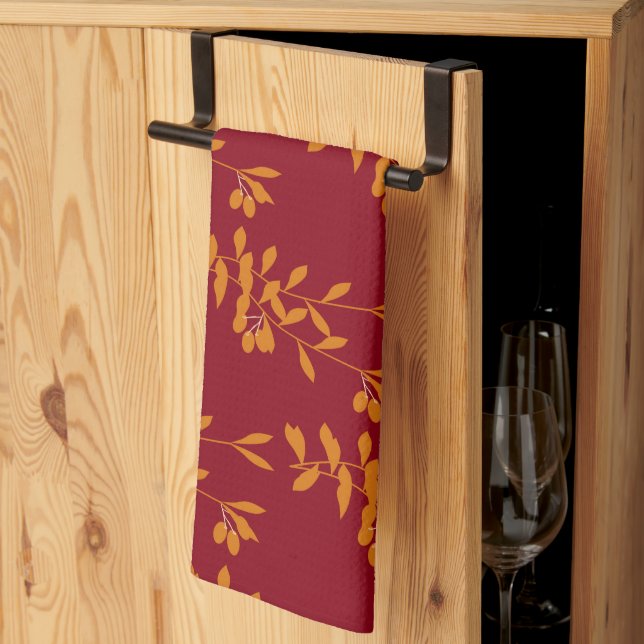 Linge De Cuisine Feuilles de branches de silhouette orange sur roug (Pliage en tiers)