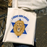Lion of Judah Star of David . I Stand with Israel Tote Bag<br><div class="desc">This stylish tote bag shows your support for Israel! A graphic painting of the Lion of Judah is the focal point, over the background of the Star of David. Modern typography reads, "I Stand with Israel" in blue. A textured blue background adds a grunge look. *Artwork exclusively created by Tracey...</div>
