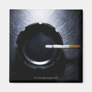 Lit Cigarette and Ashtray on Stainless Steel Magnet