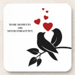 little birds with hearts coaster<br><div class="desc">Bring a tender touch to your table. This charming coaster design features a delicate black bird paired with vivid red hearts — a subtle yet powerful celebration of love, family bonds, and unforgettable moments. Perfect for cozy evenings, warm conversations, or as a heartfelt gift. Let the art speak softly, and...</div>