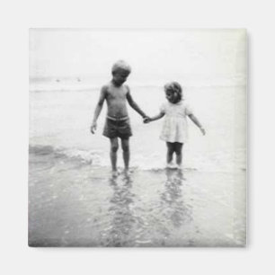 Little boy and girl holding hands magnet