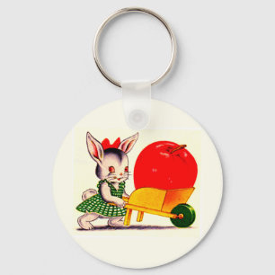 little bunny pushing cart with great big apple keychain