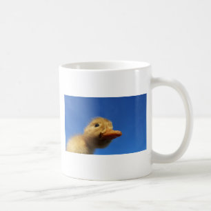 little ducklings in front of blue sky coffee mug