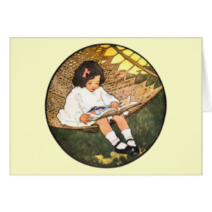 Little Girl reading in a hammock