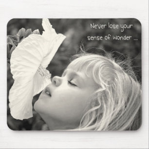 Little girl smelling hibiscus mouse pad