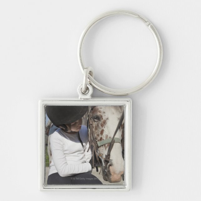 Little girl with her horse keychain (Front)