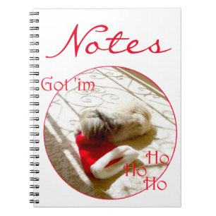 Little Pekingese Grabs Santa Notebook