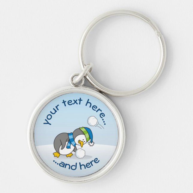 Little penguin getting a snow ball keychain (Front)