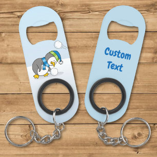 Little penguin getting a snow ball keychain bottle opener