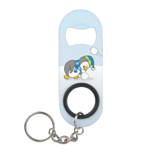 Little penguin getting a snow ball keychain bottle opener