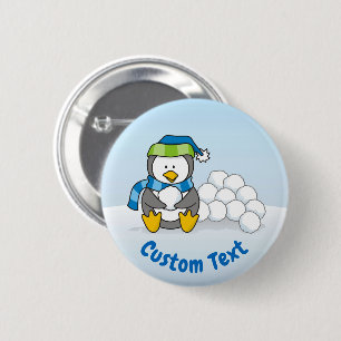Little penguin sitting with snowballs 2 inch round button