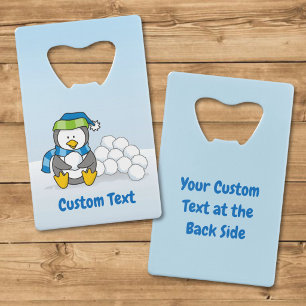 Little penguin sitting with snowballs credit card bottle opener