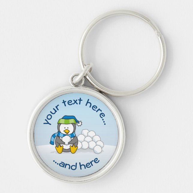 Little penguin sitting with snowballs keychain (Front)