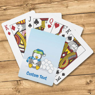 Little penguin sitting with snowballs playing card