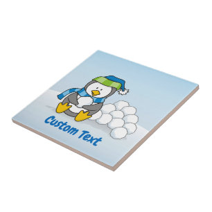 Little penguin sitting with snowballs tile