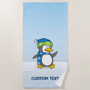 Little penguin walking on snow beach towel