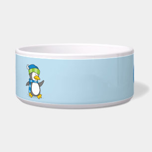 Little penguin walking on snow bowl