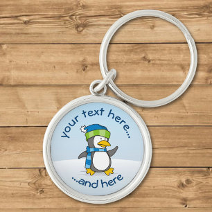 Little penguin walking on snow keychain