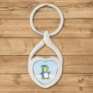 Little penguin walking on snow keychain