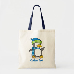Little penguin walking on snow tote bag