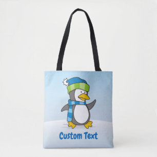Little penguin walking on snow tote bag