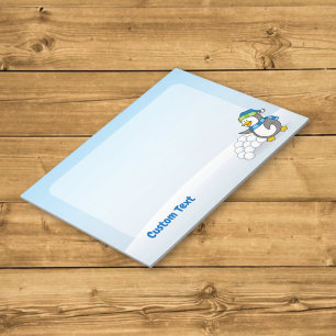 Little penguin with snow balls waving notepad