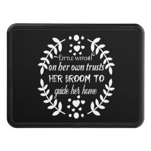 Little witch on her own trusts her broom to guide trailer hitch cover