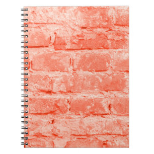 Living Coral. Brick wall background. Closeup horiz Notebook